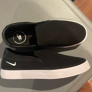 Woman’s Nike Court Legacy Slip-ons